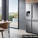Home 20 IoT 가전 활용법 주방 편리하게 만들기 - A modern German kitchen interior featuring a sleek Samsung Family Hub smart refrigerator with a larg...